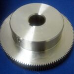 AQUAFLEX 128T DIE DRIVE GEAR 128 TOOTH, 1" BORE, 1/8 P, 20 PD USED ON INSTAFLEX 16" PRESS 5" OVAL OD, 1" BORE, 1/4" KEYWAY, 3 3/8" HUB OD, 1" HUB WIDTH, 1" GEAR WIDTH, 1/4" GEAR BEVEL ON THE NON-HUB SIDE